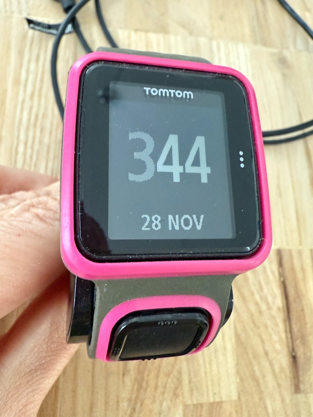 Tomtom black and pink running watch with charger